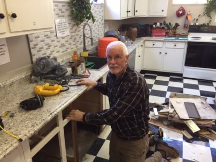 Phil Turner prepares to install dishwasher